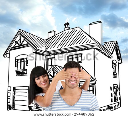 Young couple on house drawing background