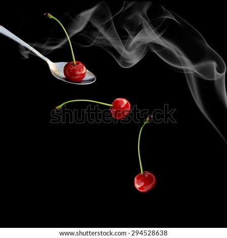 sweet cherry on a black background