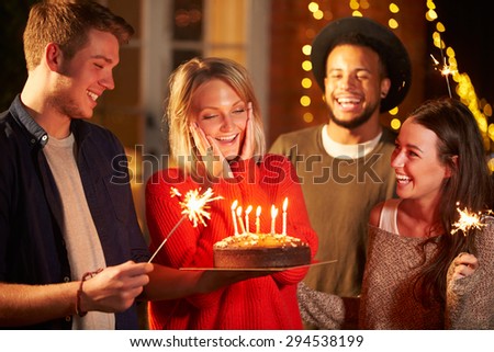 Group Of Friends Celebrating Birthday At Outdoor Party