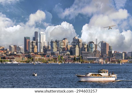 Seattle Washington City Skyline from Lake Union with White Clouds and Blue Sky