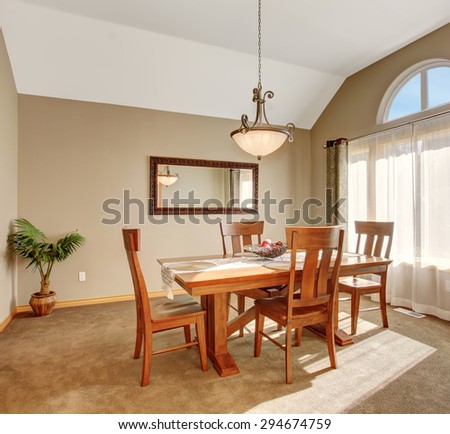 Traditional dinning room with tan carpet, in beautiful northwest home.