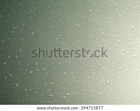 art of water drops on color glass background
