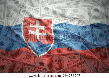 colorful waving slovak flag on a american dollar money background