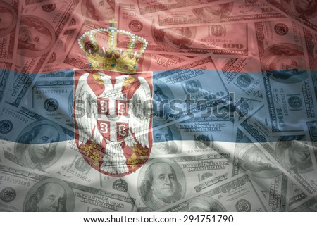 colorful waving serbian flag on a american dollar money background