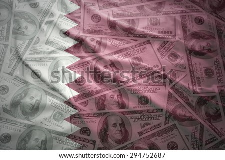 colorful waving qatar flag on a american dollar money background