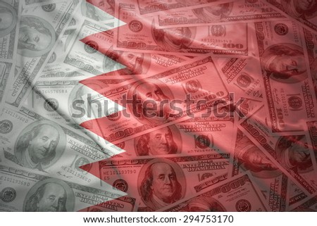 colorful waving bahrain flag on a american dollar money background