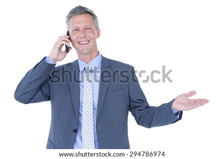 Portrait of a successful businessman on phone against white background