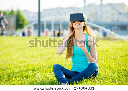 Girl uses head-mounted display in park