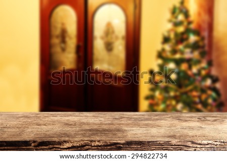 dark brown wooden desk and xmas tree 