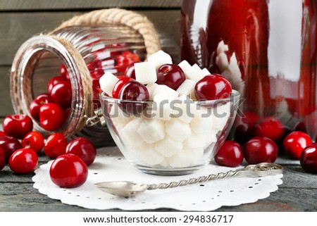 Ingredients for cherry compote on table, on light background