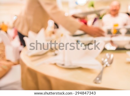 image of blur people on dinning table set for background usage .
