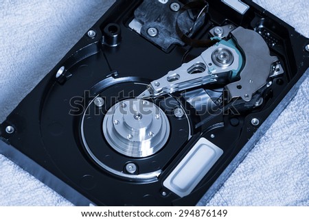 Close up of open computer hard disk drive (HDD). Inside harddisk