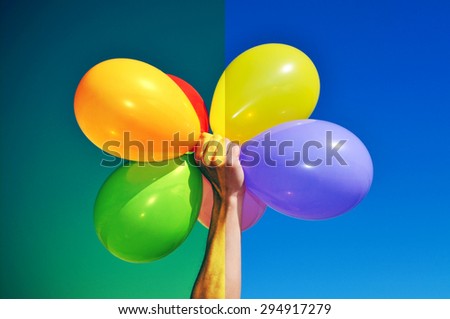 man holding a bunch of balloons of different colors before (right) and after (left) applying a filter during the image editing process