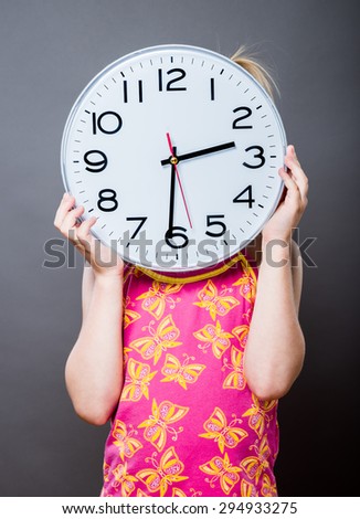 picture of beautiful girl with big clock