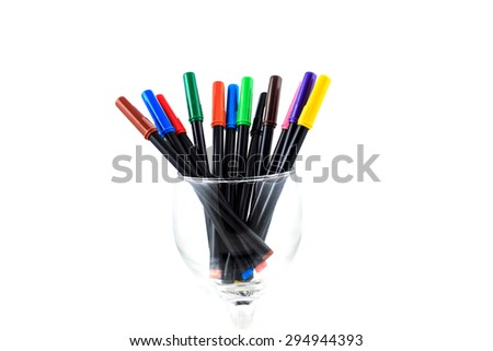 colorful pens in a glass