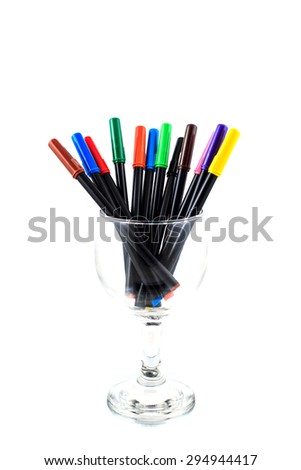 colorful pens in a glass