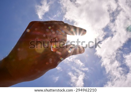 Picture of an Hand over the Sky and Sun