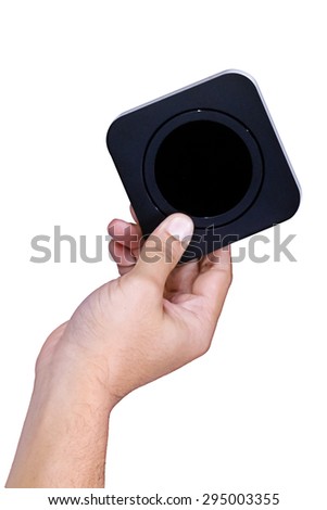 Hand holding square black box and black circle inside box on white background