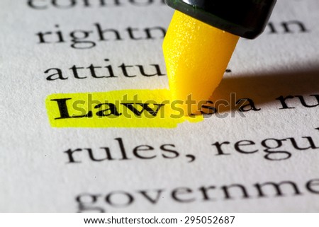 Word law highlighted with a yellow marker Royalty-Free Stock Photo #295052687