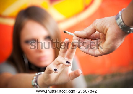 cropped view of two young adults smoking a joint Royalty-Free Stock Photo #29507842