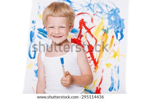 Cute little boy painting with brush. School. Preschool. Education. Creativity. Studio portrait over white background