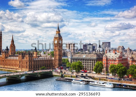 Big Ben, Westminster Bridge on River Thames in London, the UK. English symbol. Lovely puffy clouds, sunny day Royalty-Free Stock Photo #295136693