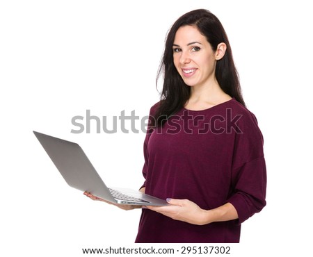 Brunette woman use of the laptop computer