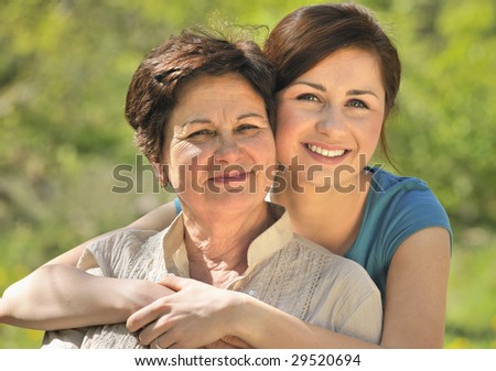 senior woman with her granddaughter outdoors