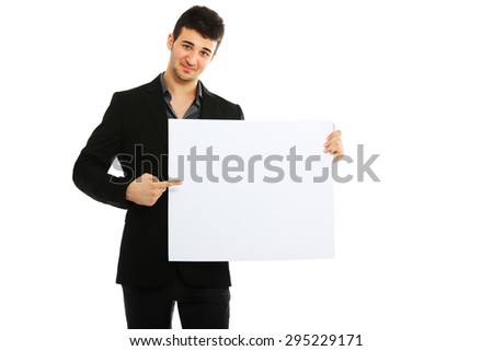 Young businessman holding blank board isolated on white background