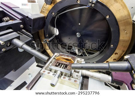 Detail of stainless steel machinery in physics laboratory Royalty-Free Stock Photo #295237796