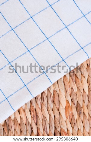checkered tablecloth on basket background - free space for your text