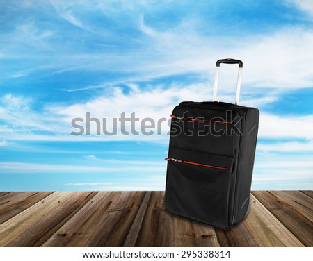 travel suitcase on wood texture