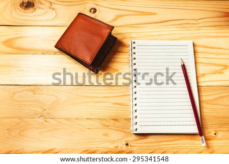 Notebook and pencil prepared for doing business or travel