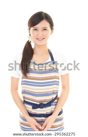 Smiling woman wearing an apron