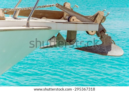 Anchor on the bow boat on the background of turquoise sea