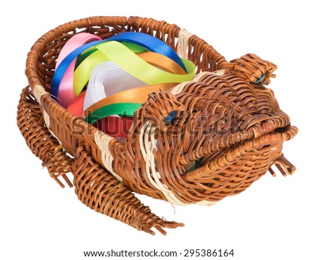 Wicker basket in the form of a frog with color bands inside isolated on white background.Three-quarter view.
