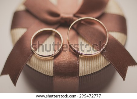 Close up wedding golden rings on gift box