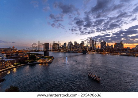 New York City downtown buildings skyline Brooklyn Bridge sunset evening