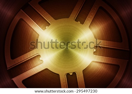 Metal wheel in bright light as futuristic background.