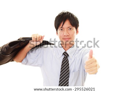 Happy business man showing thumbs up sign 