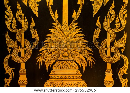 Thai style hand painting art golden color on window of the temple