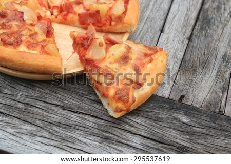 pizza on wooden table background