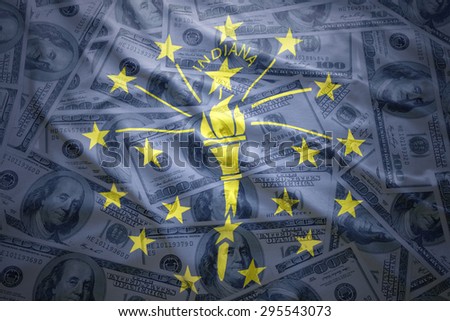 colorful waving indiana state flag on a american dollar money background