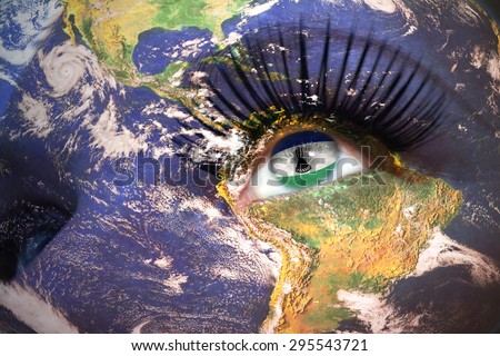 womans face with planet Earth texture and lesotho flag inside the eye. Elements of this image furnished by NASA.