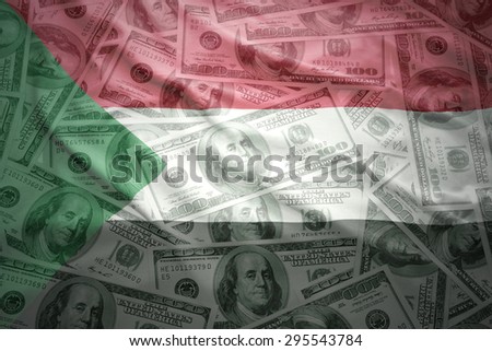 colorful waving sudanese flag on a american dollar money background