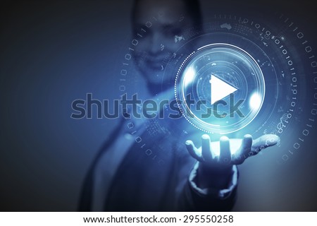 Businesswoman with media player button in palm