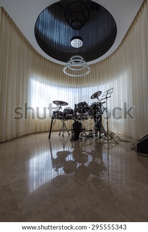 drum set with reflection on the floor