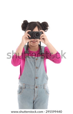Cute asian girl holding  camera on white background isolated