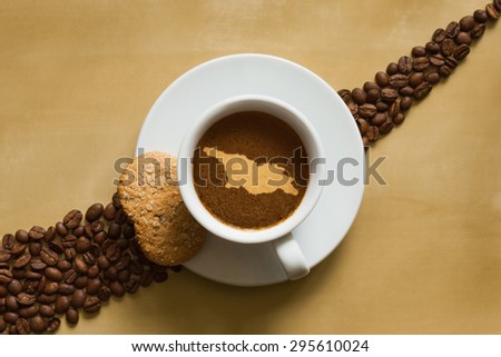 Still life photography of hot coffee beverage with map of Georgia