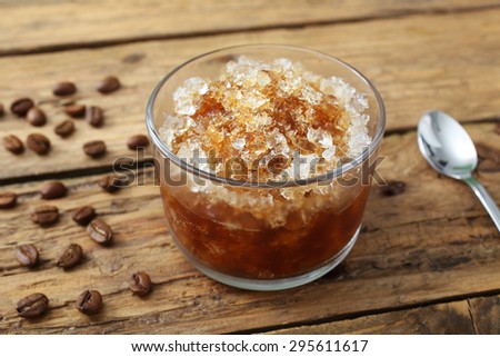 frozen coffee drink in glass rustic background